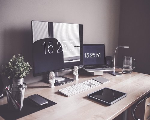 Well organized ergonomic desk setup with proper lighting